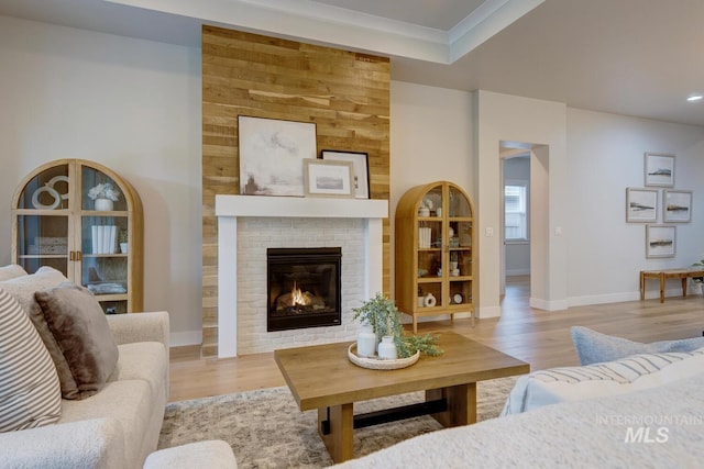 4014 W Farm View Dr, Boise, ID 83714 - living room with wood finished floors, a brick fireplace, ornamental molding, baseboards, and recessed lighting
