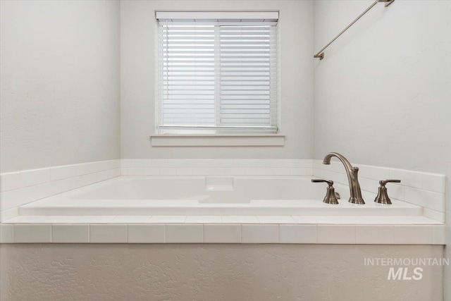 full bathroom featuring a bath