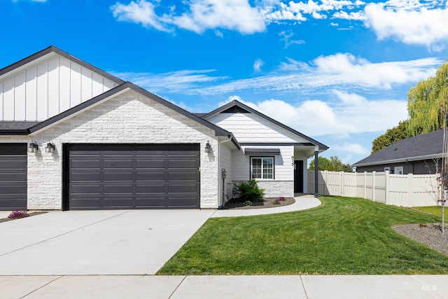 875 N 14th St, Payette, ID 83661 - single story home featuring stone siding, an attached garage, board and batten siding, and driveway