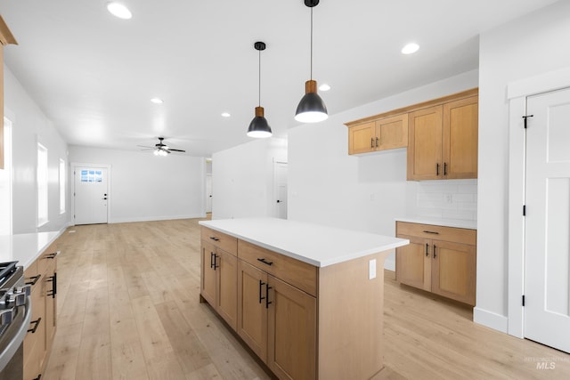 875 N 14th St, Payette, ID 83661 - kitchen featuring light wood-style flooring, recessed lighting, light countertops, ceiling fan, and hanging light fixtures