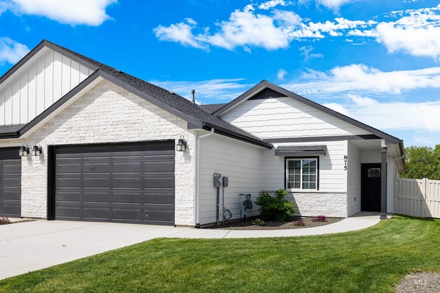 875 N 14th St, Payette, ID 83661 - view of front of property with stone siding, an attached garage, concrete driveway, and board and batten siding