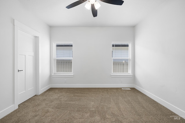 875 N 14th St, Payette, ID 83661 - unfurnished room with carpet floors, ceiling fan, and baseboards