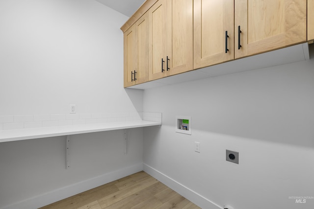 875 N 14th St, Payette, ID 83661 - washroom featuring cabinet space, electric dryer hookup, light wood finished floors, baseboards, and washer hookup