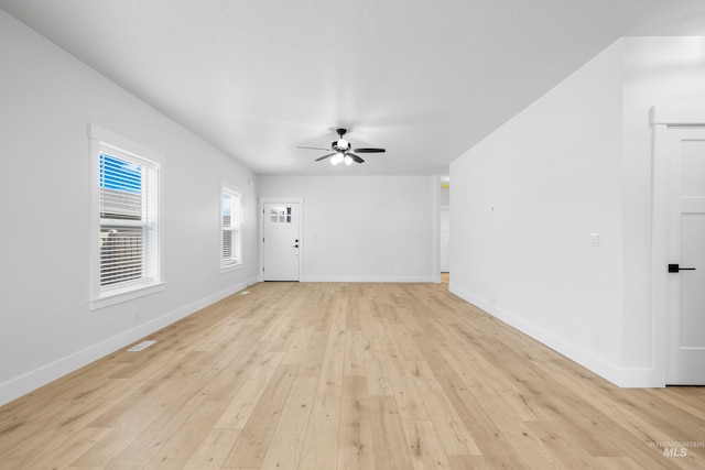 875 N 14th St, Payette, ID 83661 - unfurnished living room featuring light wood-style flooring, ceiling fan, and baseboards