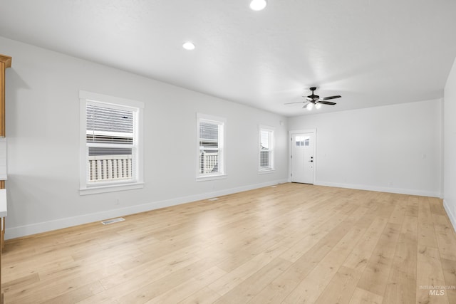 875 N 14th St, Payette, ID 83661 - unfurnished living room featuring ceiling fan, baseboards, light wood finished floors, and recessed lighting