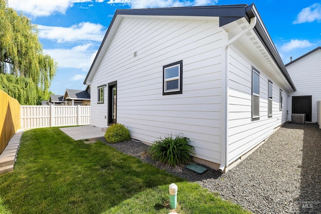 875 N 14th St, Payette, ID 83661 - view of side of home featuring central AC and a patio area