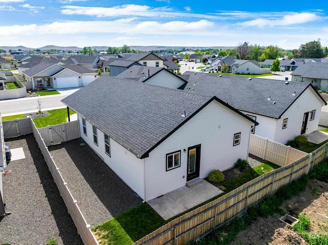 875 N 14th St, Payette, ID 83661 - back of house with a residential view, a patio area, roof with shingles, and a fenced backyard