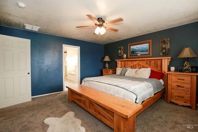 2059 Spring Creek Dr, Fruitland, ID 83619 - carpeted bedroom with ensuite bathroom, baseboards, a ceiling fan, and visible vents