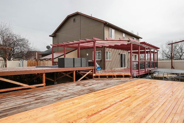 2059 Spring Creek Dr, Fruitland, ID 83619 - wooden deck with fence, a trampoline, and a pergola
