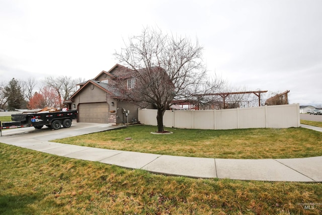 2059 Spring Creek Dr, Fruitland, ID 83619 - view of property exterior with driveway, fence, a garage, and a lawn