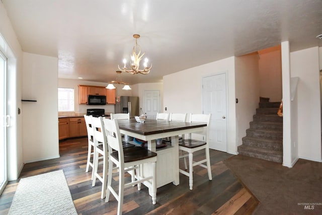 2059 Spring Creek Dr, Fruitland, ID 83619 - dining area with a notable chandelier, dark wood-style floors, and stairs