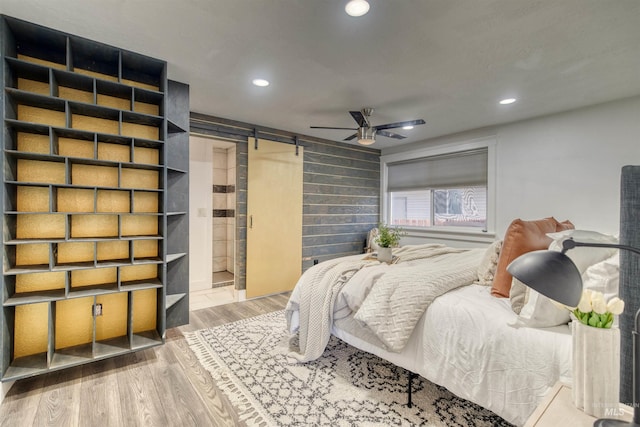 bedroom featuring ceiling fan and hardwood / wood-style floors