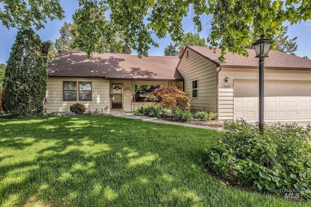 1245 SW 3rd Ave, Ontario, OR 97914 - ranch-style home featuring a front lawn, an attached garage, and a shingled roof
