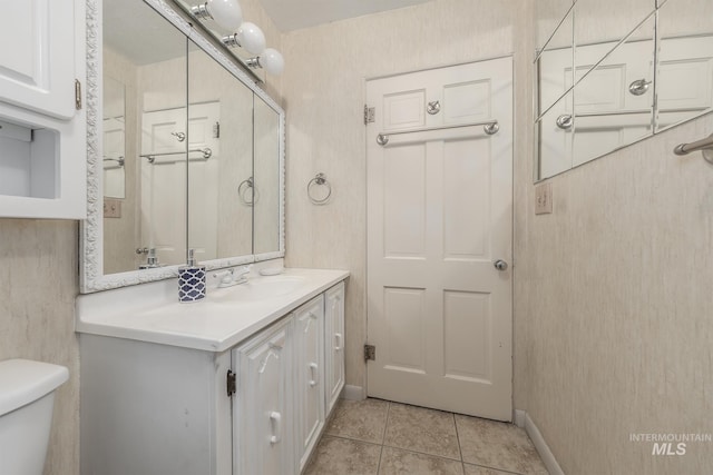 1245 SW 3rd Ave, Ontario, OR 97914 - bathroom with tile patterned floors, vanity, toilet, and baseboards