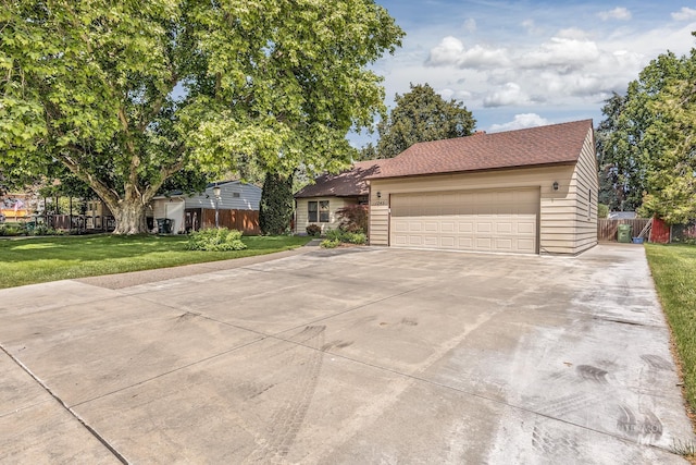 1245 SW 3rd Ave, Ontario, OR 97914 - view of front of property with a front lawn, concrete driveway, and an attached garage