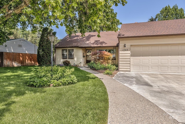 1245 SW 3rd Ave, Ontario, OR 97914 - view of front of home featuring driveway, a garage, and roof with shingles