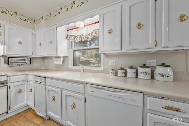 1245 SW 3rd Ave, Ontario, OR 97914 - kitchen featuring dishwasher, a sink, white cabinetry, and light countertops