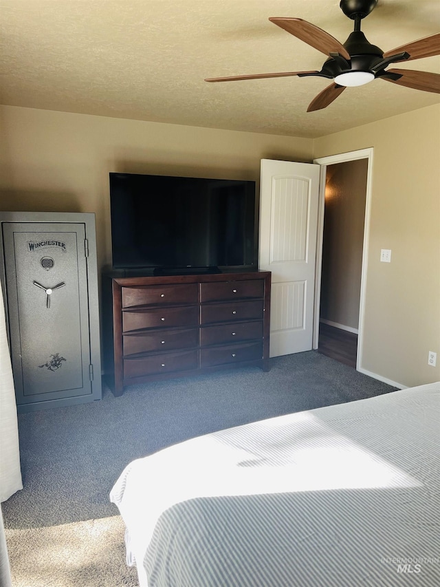 bedroom featuring carpet, a ceiling fan, and baseboards