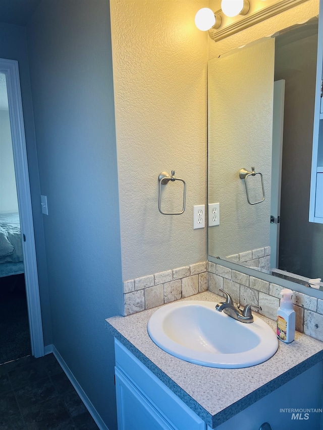 bathroom with vanity and backsplash