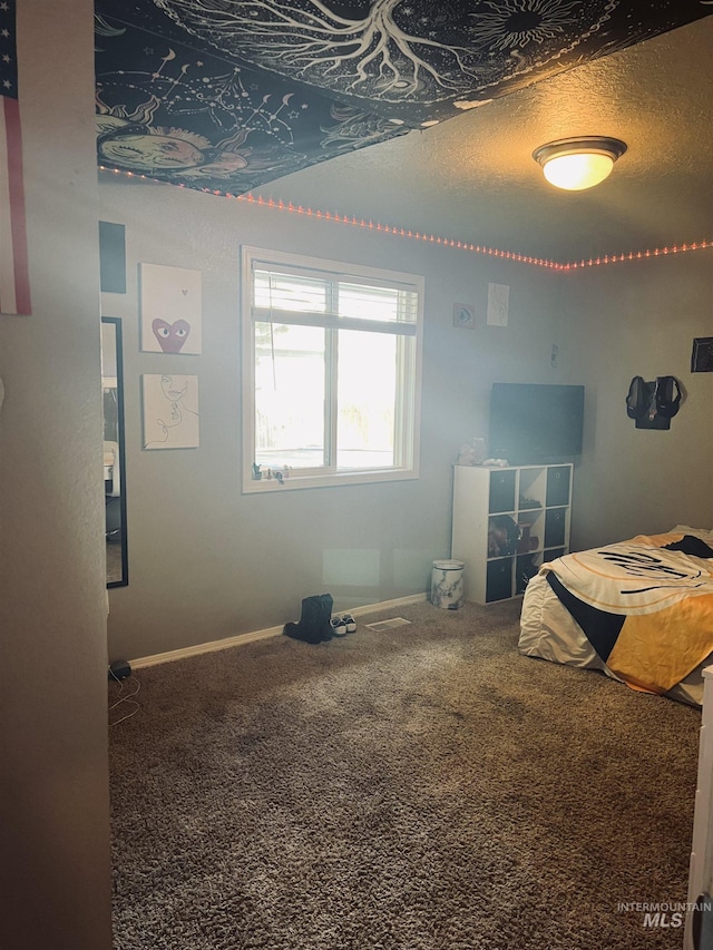 carpeted bedroom with baseboards