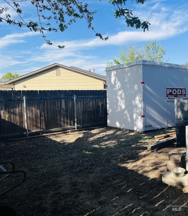 garage with fence