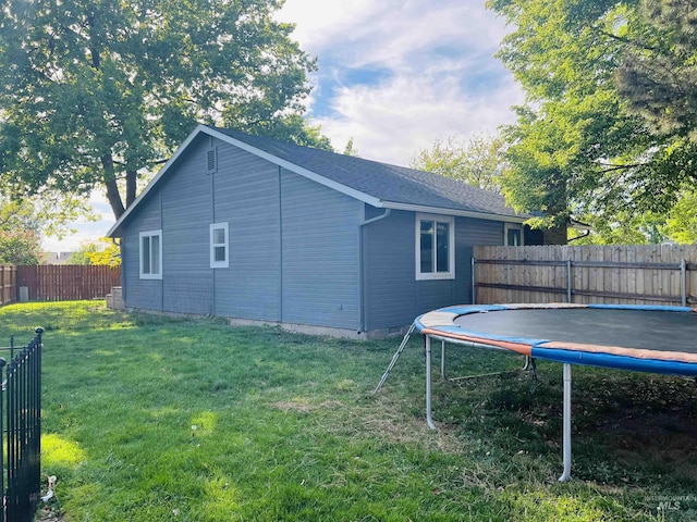 view of side of property featuring a trampoline