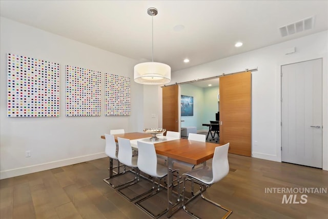1891 E Golden Oak Ct, Meridian, ID 83646 - dining room featuring a barn door, wood finished floors, baseboards, and recessed lighting