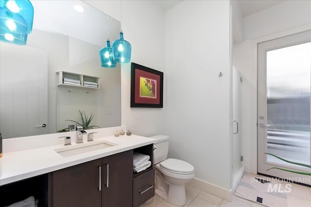 1891 E Golden Oak Ct, Meridian, ID 83646 - full bath with vanity, toilet, a shower stall, and tile patterned floors