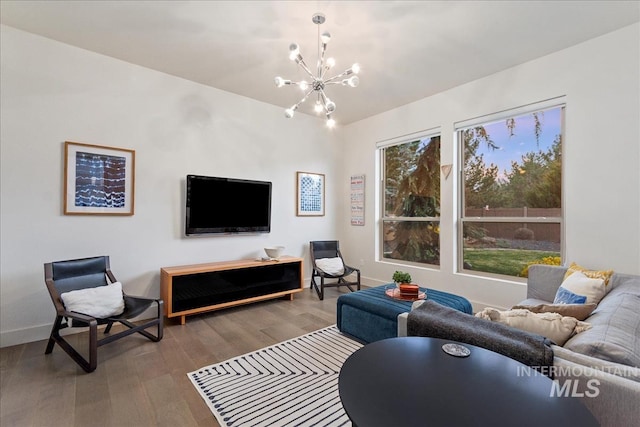 1891 E Golden Oak Ct, Meridian, ID 83646 - living area with a chandelier, wood finished floors, and baseboards
