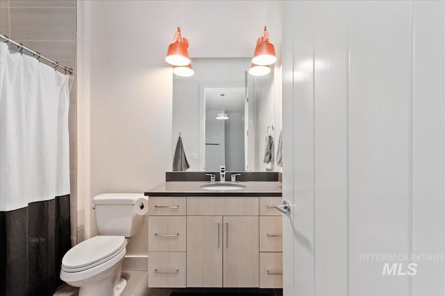 1891 E Golden Oak Ct, Meridian, ID 83646 - bathroom featuring vanity, toilet, baseboards, a shower with curtain, and tile patterned floors