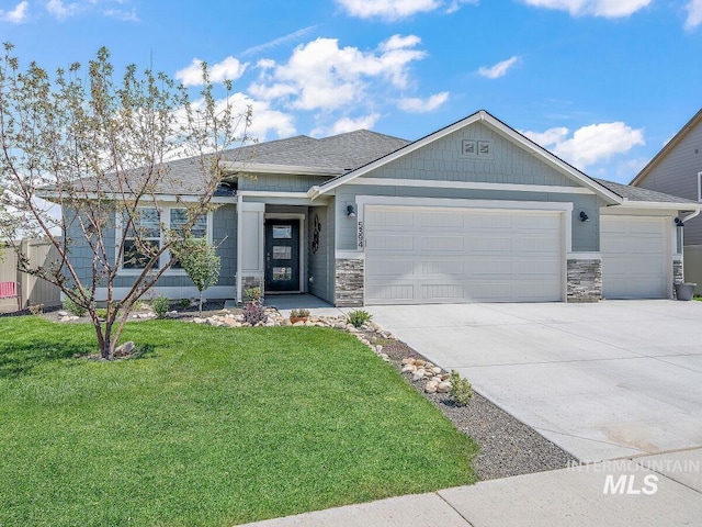5394 N Elmstone Ave, Meridian, ID 83646 - view of front of property with a garage, stone siding, and a front yard
