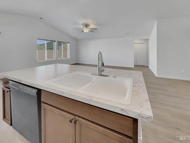 5394 N Elmstone Ave, Meridian, ID 83646 - kitchen with dishwasher, a sink, ceiling fan, open floor plan, and lofted ceiling