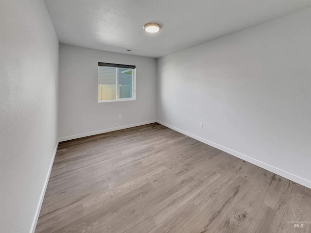5394 N Elmstone Ave, Meridian, ID 83646 - unfurnished room featuring wood finished floors and baseboards