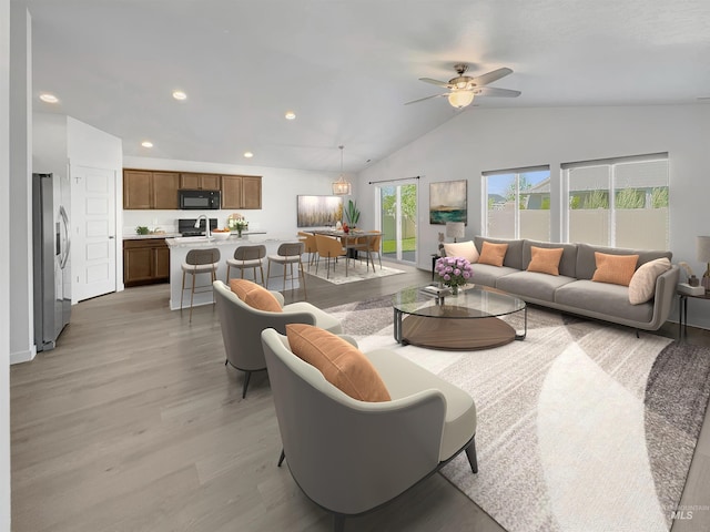 5394 N Elmstone Ave, Meridian, ID 83646 - living area with vaulted ceiling, light wood-style flooring, a ceiling fan, and recessed lighting
