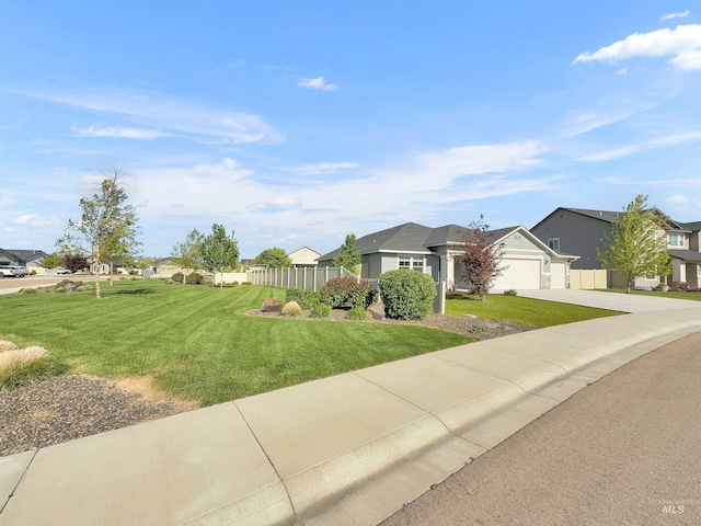 5394 N Elmstone Ave, Meridian, ID 83646 - view of front facade with a residential view, concrete driveway, and a garage
