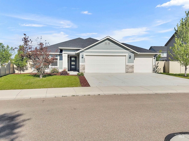 5394 N Elmstone Ave, Meridian, ID 83646 - view of front of house with a garage, concrete driveway, and stone siding