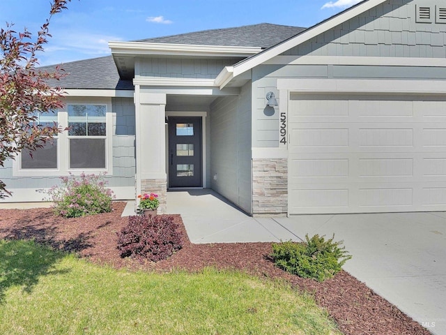 5394 N Elmstone Ave, Meridian, ID 83646 - entrance to property featuring a shingled roof, a garage, and stone siding