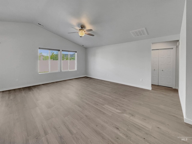 5394 N Elmstone Ave, Meridian, ID 83646 - empty room featuring a ceiling fan, light wood-style floors, lofted ceiling, and baseboards