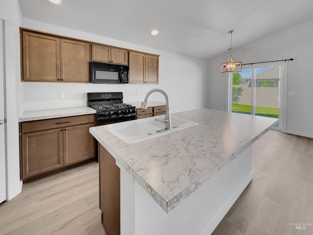 5394 N Elmstone Ave, Meridian, ID 83646 - kitchen with black appliances, a sink, light wood-type flooring, vaulted ceiling, and recessed lighting