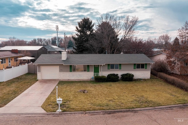 single story home with a front lawn and a garage