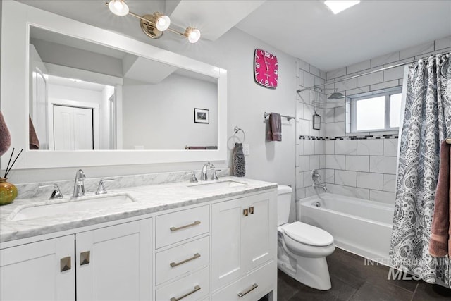 full bathroom featuring double vanity, a sink, toilet, and shower / bath combo with shower curtain