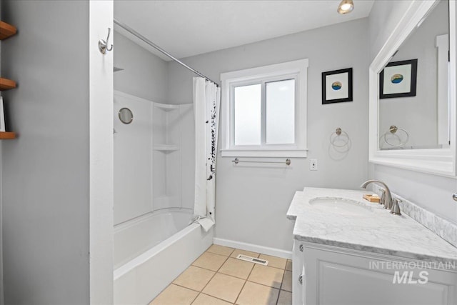 bathroom featuring visible vents, baseboards, tile patterned floors, shower / bathtub combination with curtain, and vanity