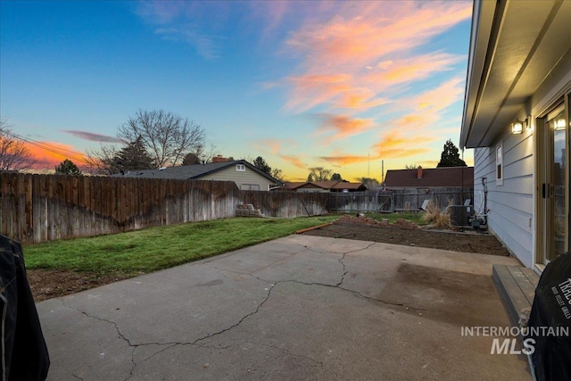 view of patio with a fenced backyard and central AC unit