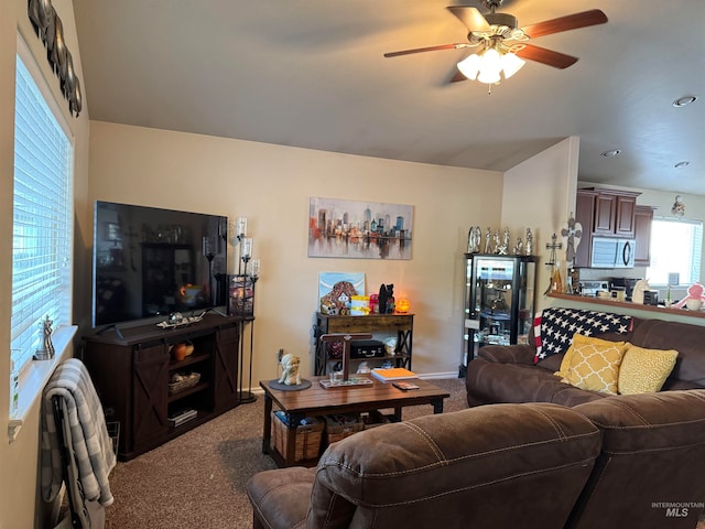 living room with carpet flooring and ceiling fan