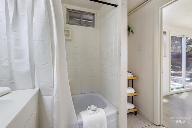 bathroom featuring shower / bath combo, tile patterned flooring, and vanity