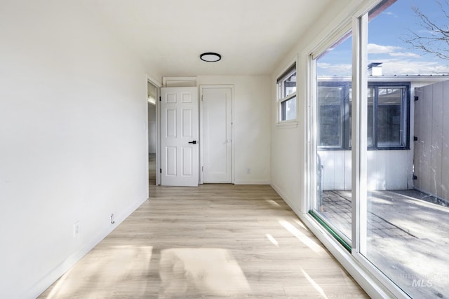 empty room with light wood-style flooring