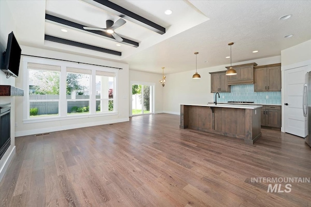 kitchen with ceiling fan, baseboards, tasteful backsplash, dark wood-type flooring, and recessed lighting