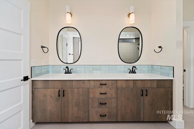 full bathroom with double vanity and backsplash