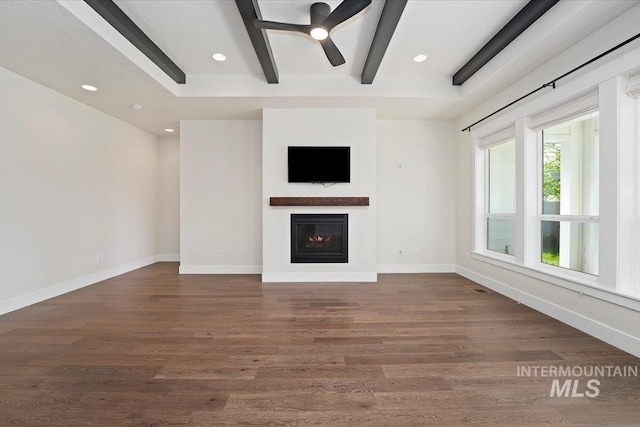 unfurnished living room featuring a ceiling fan, a glass covered fireplace, wood finished floors, recessed lighting, and baseboards