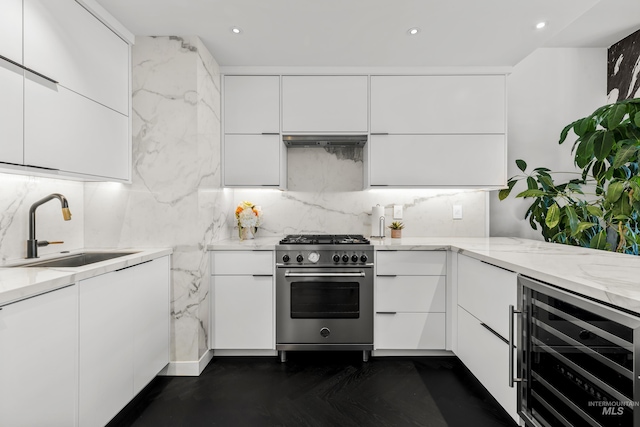 255 S Capitol Blvd Unit 1403, Boise, ID 83702 - kitchen with high end stainless steel range oven, wine cooler, modern cabinets, white cabinets, and recessed lighting